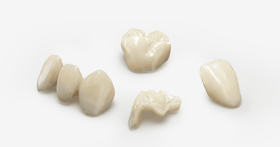 Impresora 3D de resina PioNext Mini 3 Diversos componentes dentales y restauraciones en tonos naturales, ideales para tratamientos odontológicos.